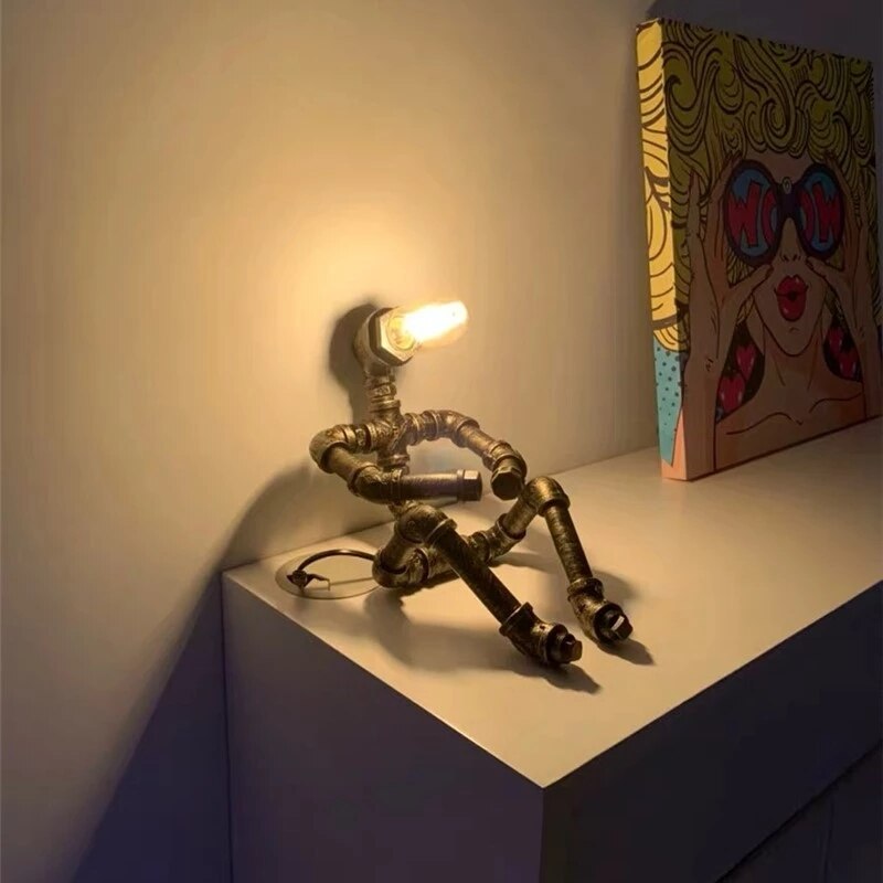 Lampe à poser industrielle LED figure robotique métallique Nile