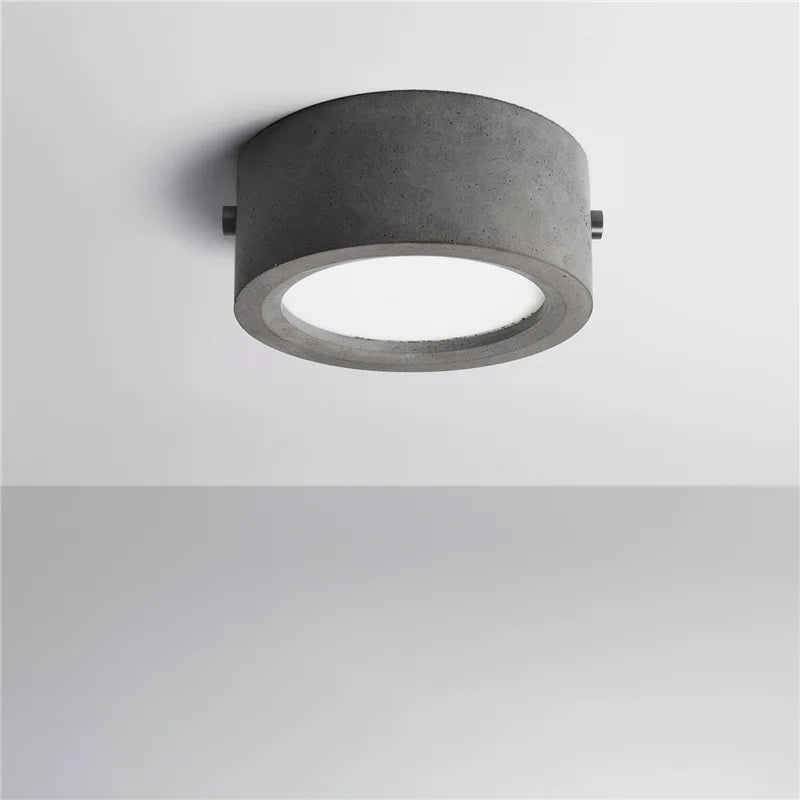 Plafonnier rond en ciment pour salon Mélanie Clairval - Courbes Douces & Décor Équilibré