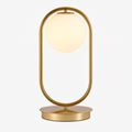 Lampe de chevet design en métal doré et boule en verre