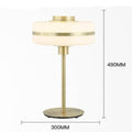 Lampe de chevet moderne LED aux formes arrondies et pied doré Hotel